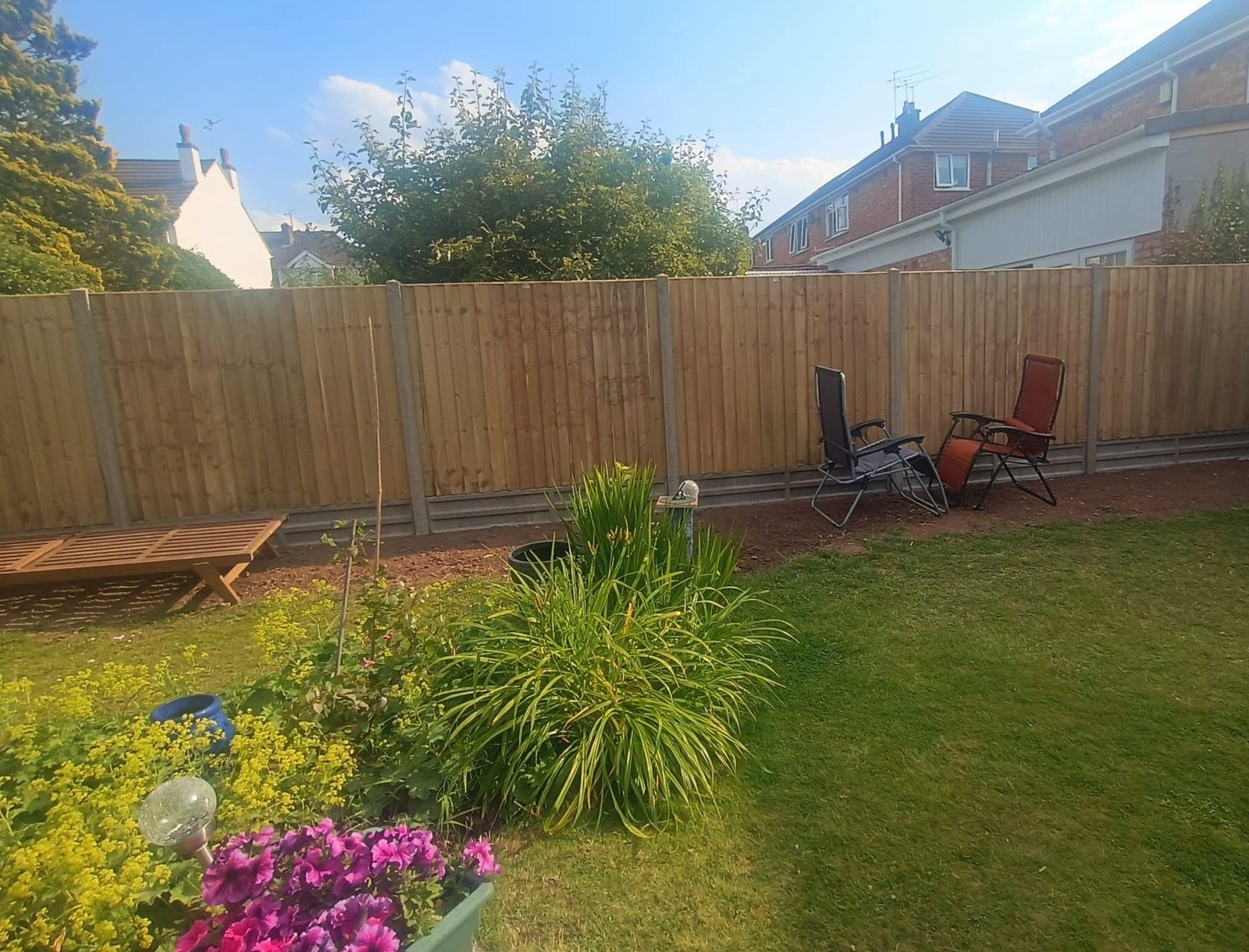 High quality wooden fence with concrete gravel board 